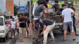 Sappe bersama dengan anak muda sekitar sedang menambal jalan jembatan Sumpang Minangae yang berlubang