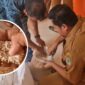 Aparat desa memeriksa beras Bapanas yang ditemukan masyarakat menguning dan berwarna hitam serta berkutu yang disalurkan oleh Bulog Pinrang, Sulsel